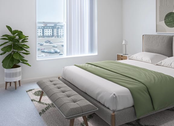 a bedroom with a bed and a chair and a window