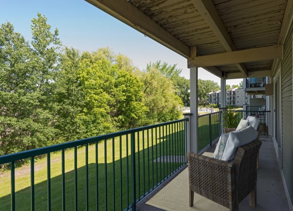 the views of the yard from the balcony of a home