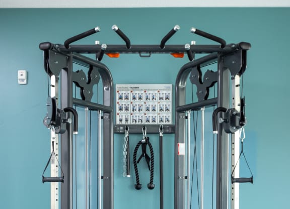 a gym ball and equipment in a room with a blue wall