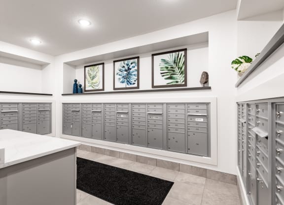 the laundry room has plenty of lockers and a granite counter top