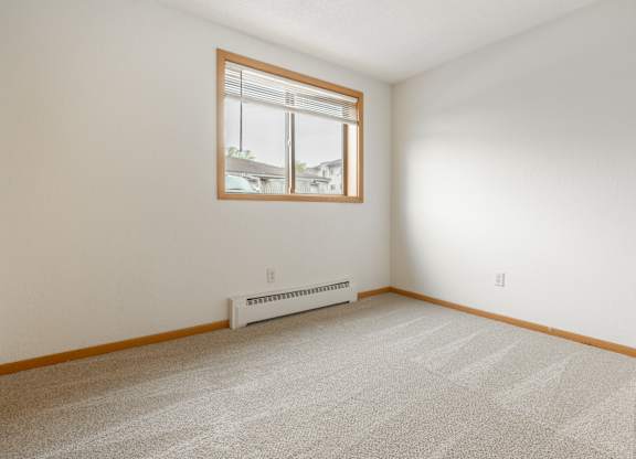 the living room of a house with a window at Ames Lake Neighborhood Apartments, St. Paul, Minnesota