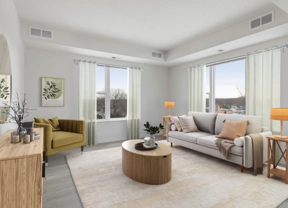 the living room of an apartment with a couch and a table