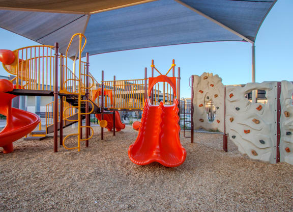 a playground with a slide and other play equipment