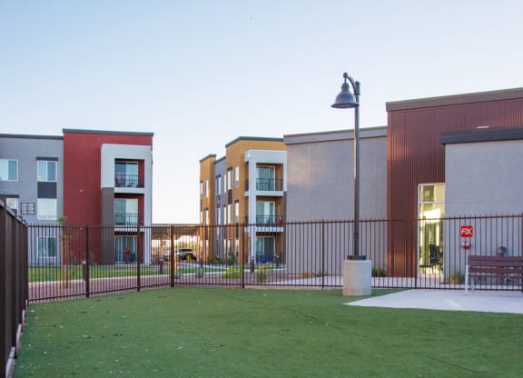 a green lawn in front of a building