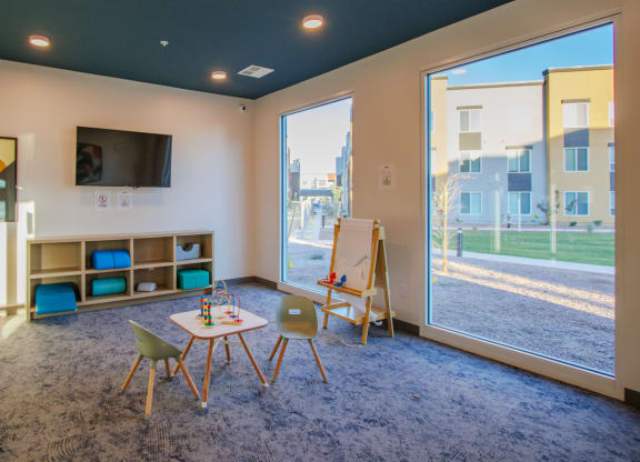 the preserve at ballantyne commons play room with table and chairs and large window