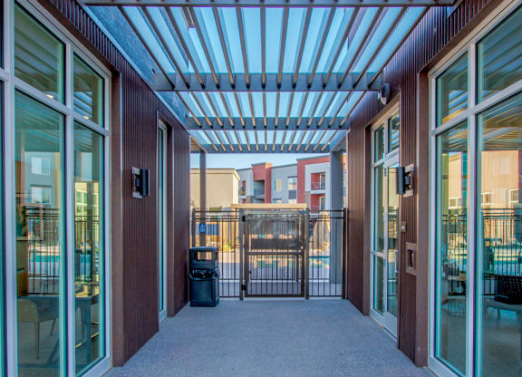 a large hallway with glass doors and a balcony