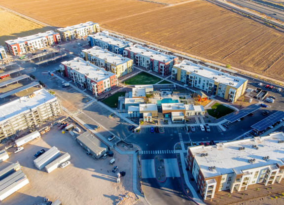 an aerial view of an airport with buildings and a field