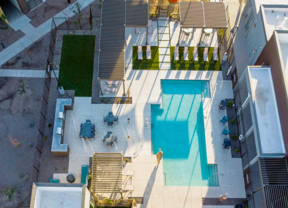 a view of the pool from the roof of a building
