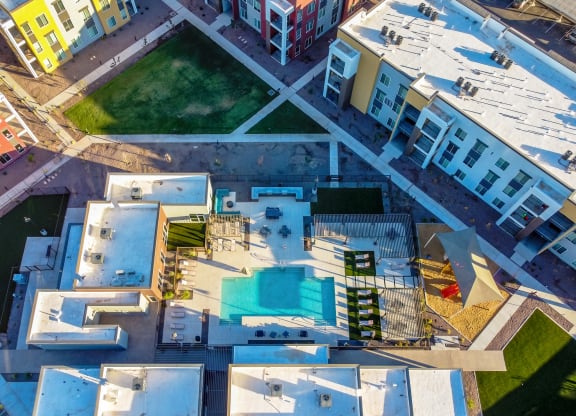 a view of the roof of a building with a swimming pool