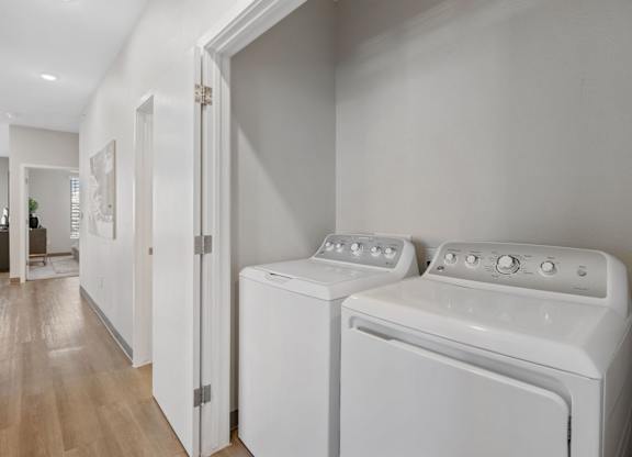 A white washer and dryer in a laundry room at Copa Flats Apartments, Arizona, 85138