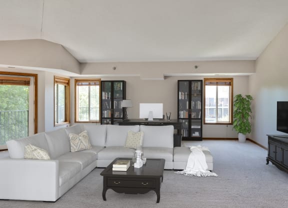 a living room with a white couch and a coffee table