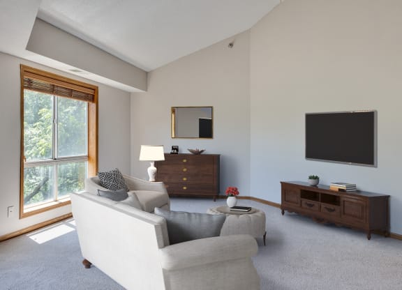 a living room with a couch and a tv