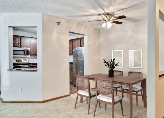 A dining room with a table and chairs. at Crosby Pointe Apartments, St. Paul , Minnesota