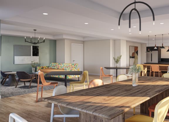 a dining room with a table and chairs and a kitchen at Decatur Landing Apartment , Brooklyn Park, MN