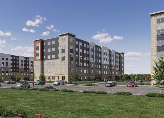 a rendering of an apartment building in a parking lot at Decatur Landing Apartment , Minnesota