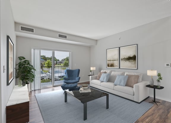 a living room with a couch and a chair and a sliding glass door at EastGate Apartments, Rochester, MN, 55904
