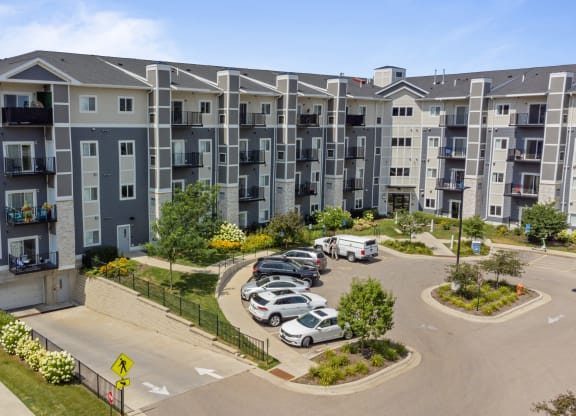 an aerial view of an apartment complex with cars parked in a parking lot at EastGate Apartments, Rochester, Minnesota