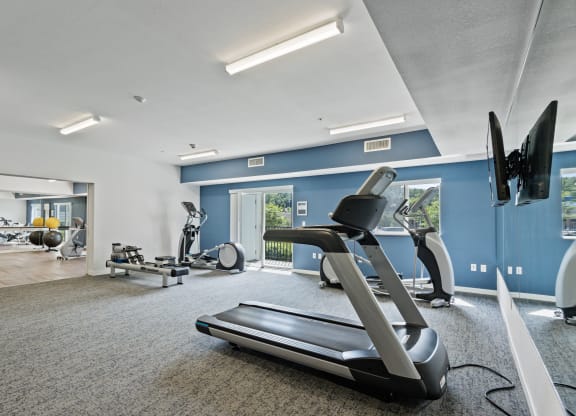 the gym with treadmills and other exercise equipment at the belgard apartments at EastGate Apartments, Minnesota