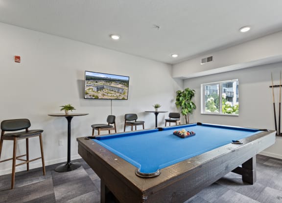 a games room with a pool table and a tv at EastGate Apartments, Rochester, MN, 55904
