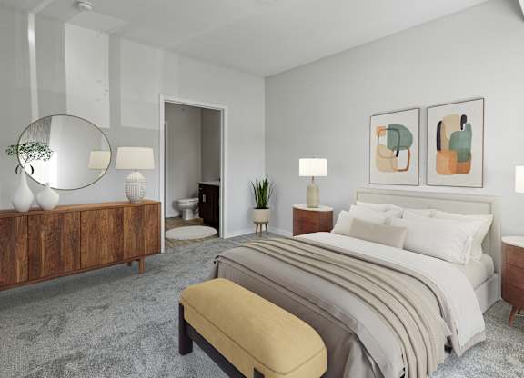 A bedroom with a large bed, a bench, and a mirror at EastGate Apartments, Rochester