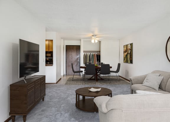 a living room with a couch and a table and a television