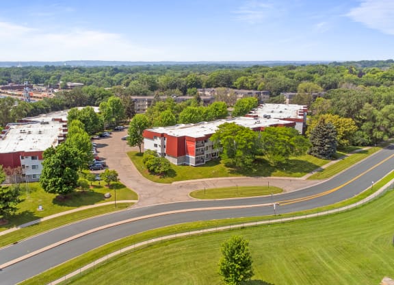 an aerial view of a campus with buildings and a road at Heritage Hills Apartments, Bloomington, MN, 55437