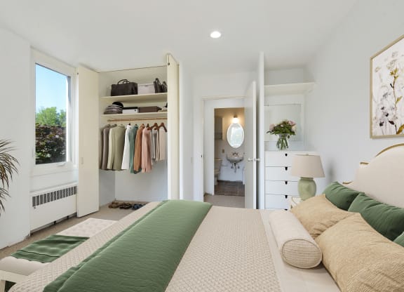 a bedroom with a bed and a closet
