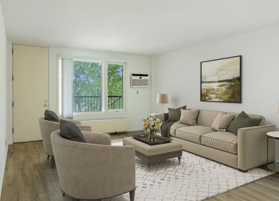 a living room with a couch and two chairs