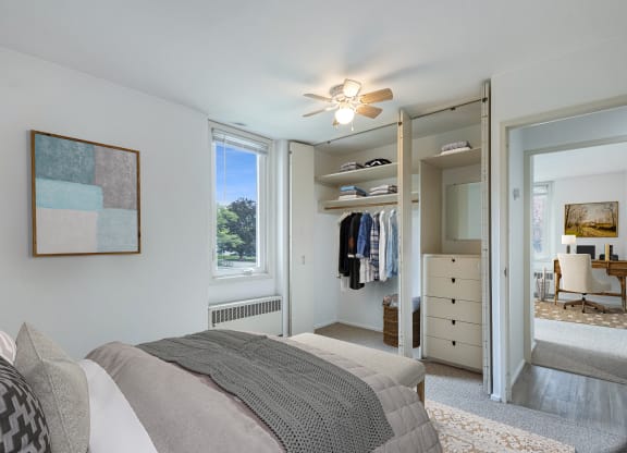 a bedroom with a bed and a closet