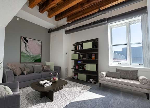 a living room with couches and a coffee table