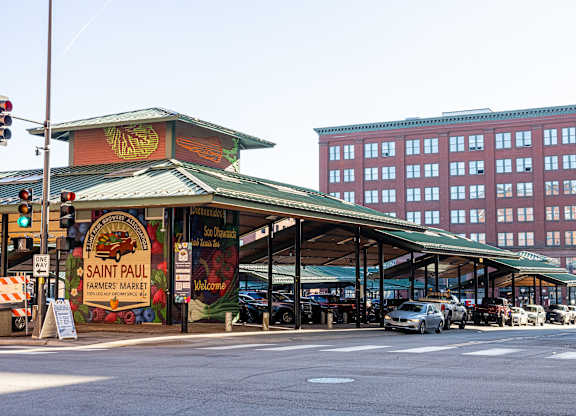 A street view of a market with a sign that says Saint Paul. at Parkside Apartments, Minnesota