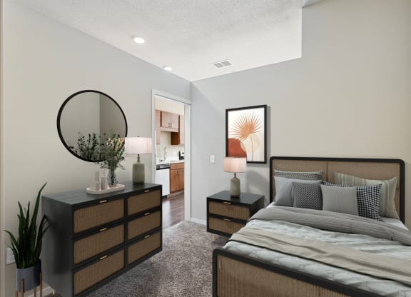 a bedroom with a bed and a dresser with a mirror
