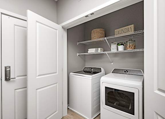 A laundry room with a washer and dryer.