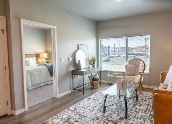 an open living room with a bedroom in the background at Technology Park Apartments, Rochester, 55901