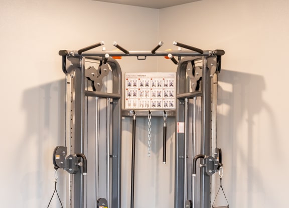 a fitness room with cardio equipment in a home gym at Technology Park Apartments, Rochester, 55901