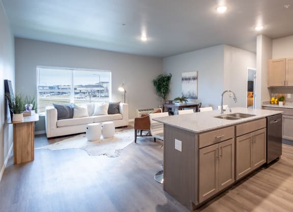 an open living room and kitchen with a view of the city at Technology Park Apartments, Rochester, MN, 55901