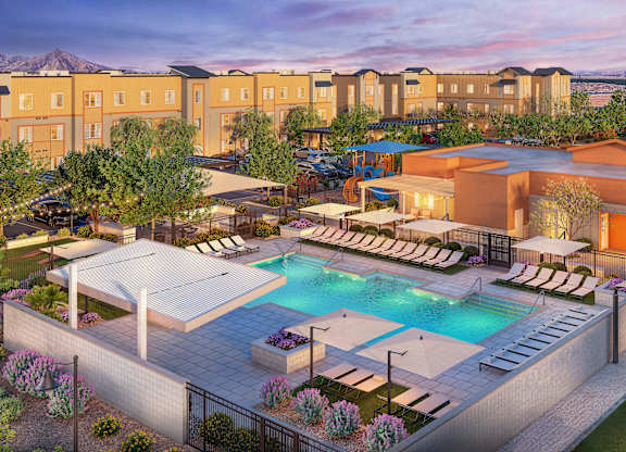 A large outdoor swimming pool surrounded by lounge chairs and umbrellas.