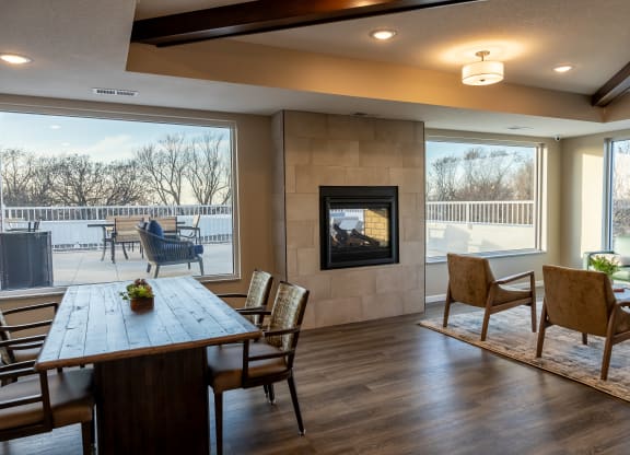 the retreat dining room with table and chairs and a fireplace