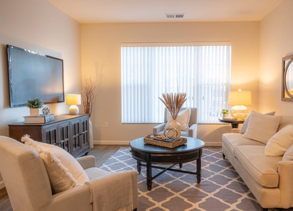 a living room with couches and a coffee table