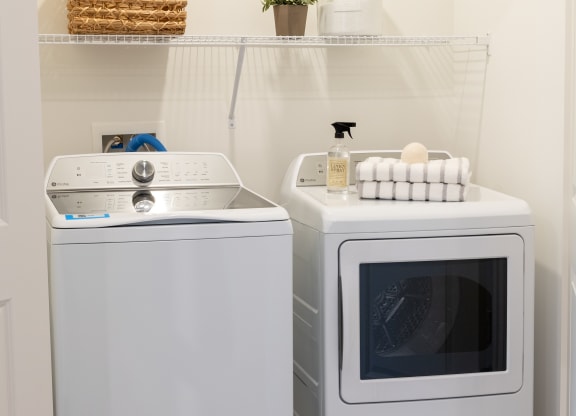a small laundry room with a washing machine and a dryer