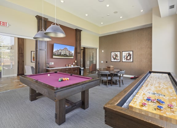 a game room with two pool tables and a billiard table at The Winslow 62+ Apartments, West St Paul