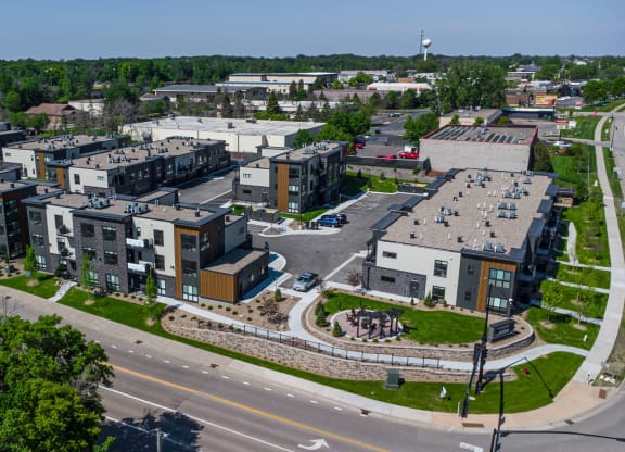 an aerial view of an urban area with buildings and a road