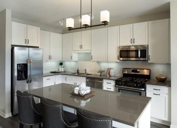 Kitchen Bar With Granite Counter Top Residences at 1700 Model Kitchen