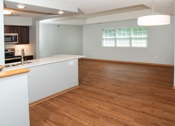 1 bedroom Wood-look flooring throughout living, dining and kitchen