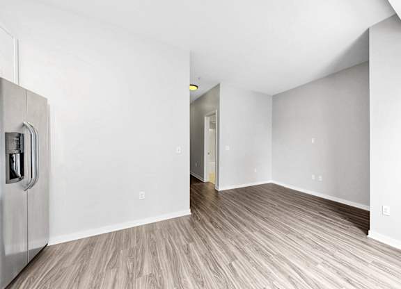A room with a wooden floor and white walls.