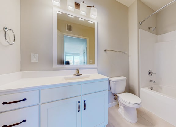 a bathroom with a sink toilet and a shower