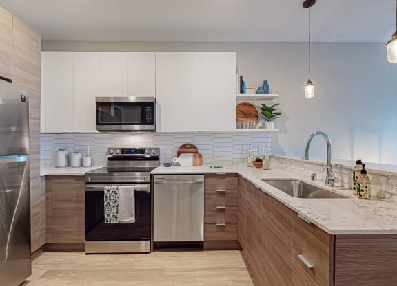 Spacious Kitchen With Pantry Cabinet at Grove80 Apartments, Cottage Grove, Minnesota