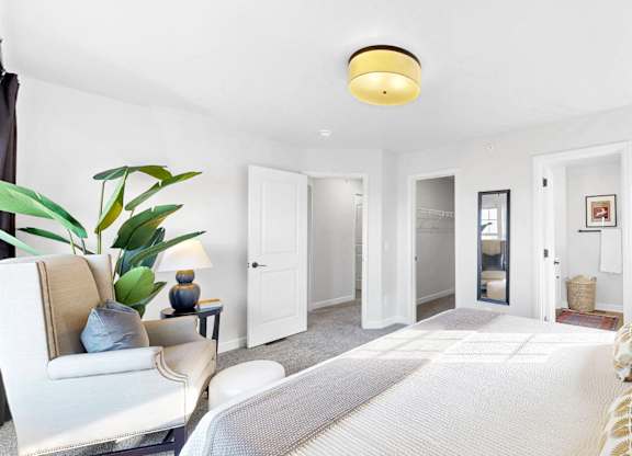 A well-lit bedroom at Field and Grove Townhomes of Champlin, Minnesota