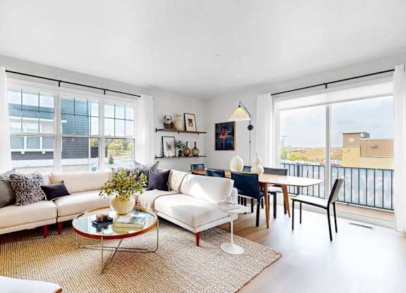 Living Room With Balcony at Field and Grove Townhomes of Champlin, Champlin, 55316