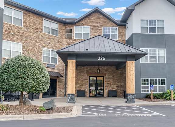 The image shows a building with the number 325 on it.